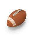 Classic brown American football with white laces and textured grip surface on a green field