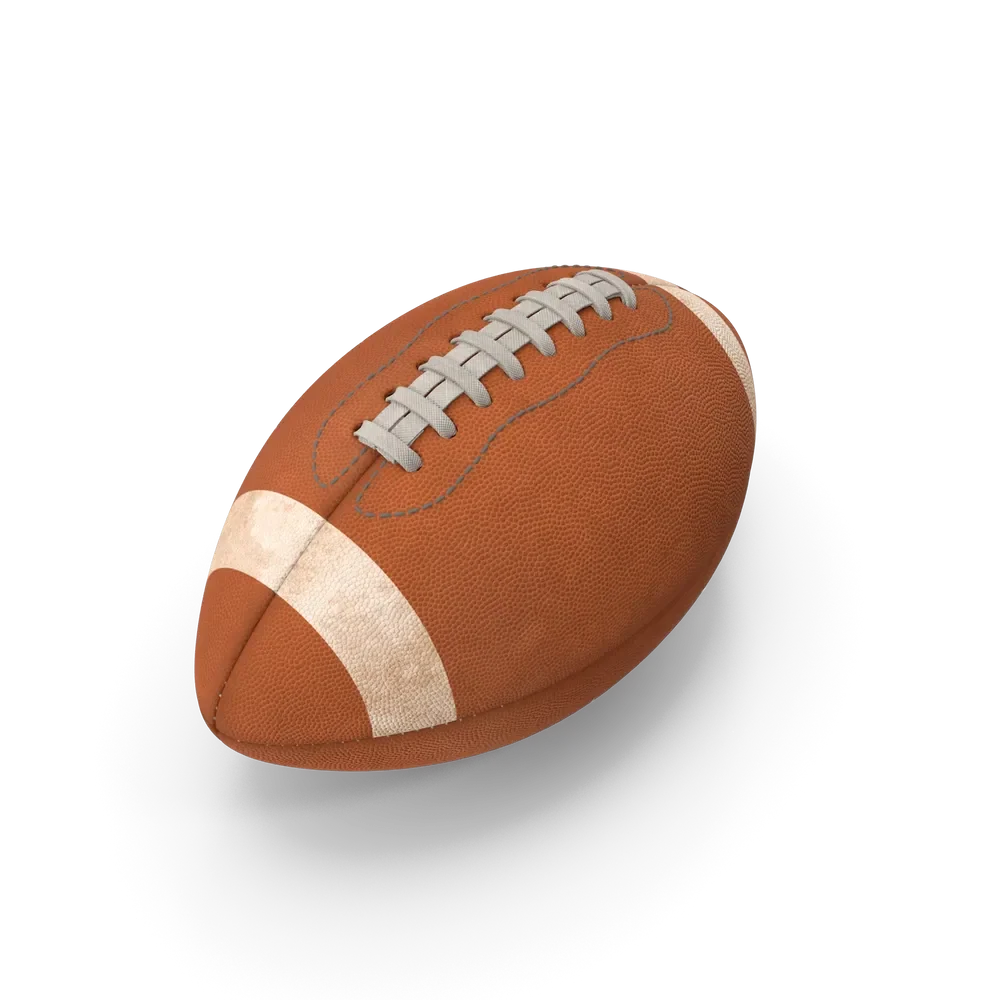 Classic brown American football with white laces and textured grip surface on a green field