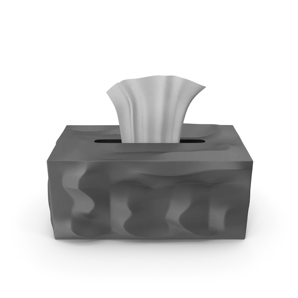 White tissue paper box with a single tissue pulled out, placed on a wooden desk surface