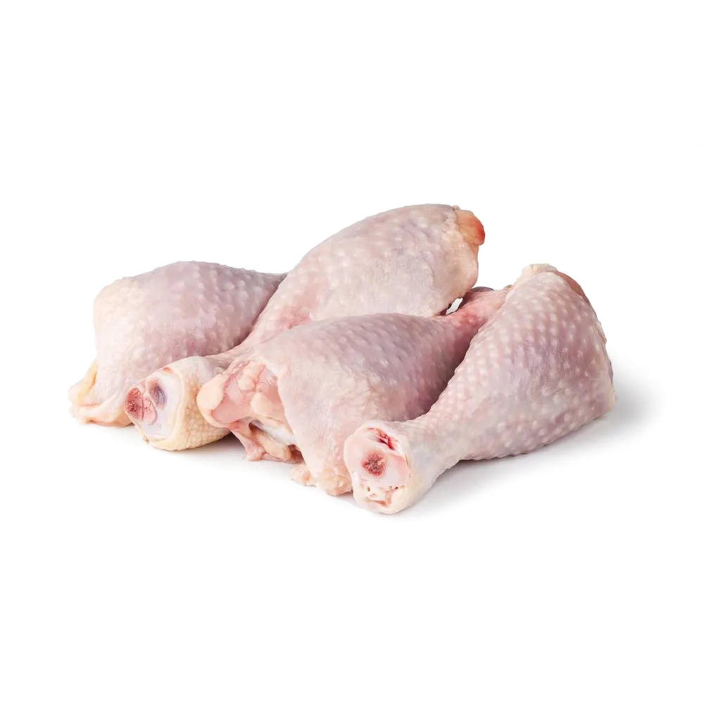 Tender fresh chicken pieces on a wooden cutting board with herbs and seasoning nearby