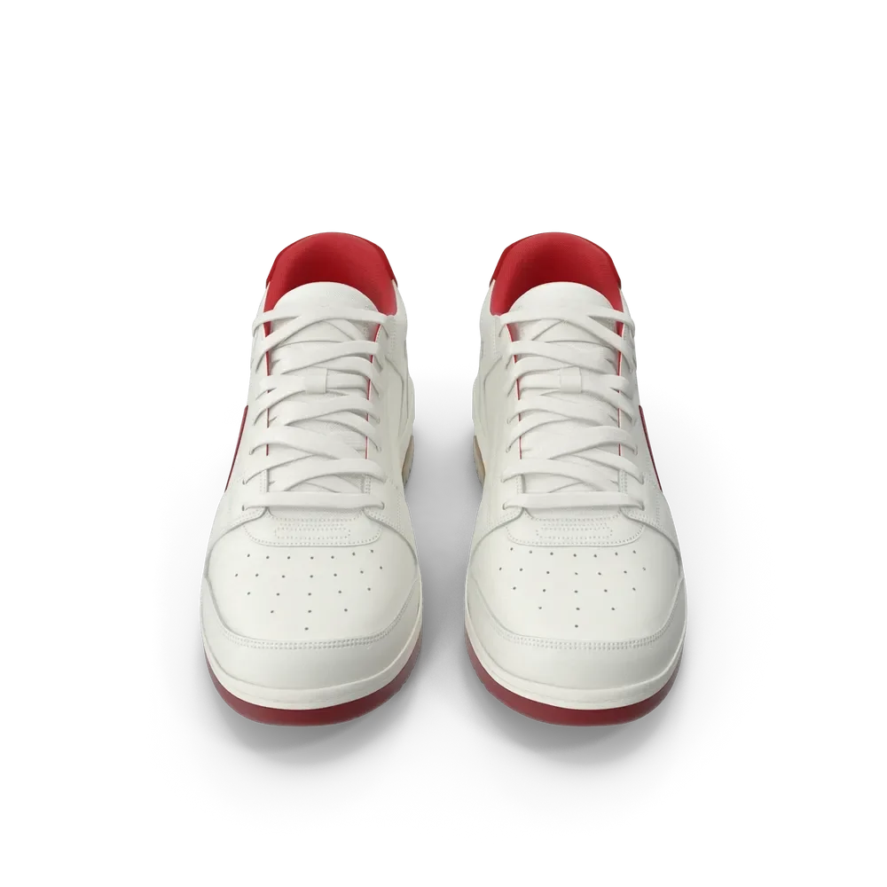 Pair of off white and red athletic sneakers displayed from above on a gym floor surface